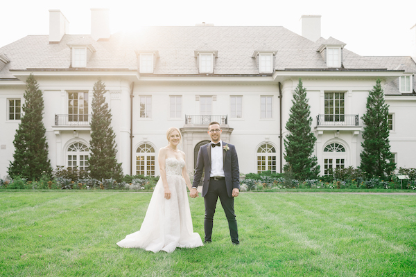 Bride and groom in front of the Lilly House during their Newfields wedding