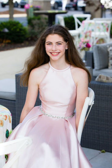 Kyra in a pink dress at her Indianapolis Bat Mitzvah