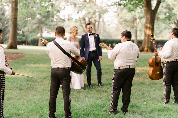 mariachis playing for the bride and groom at their Newfields wedding reception