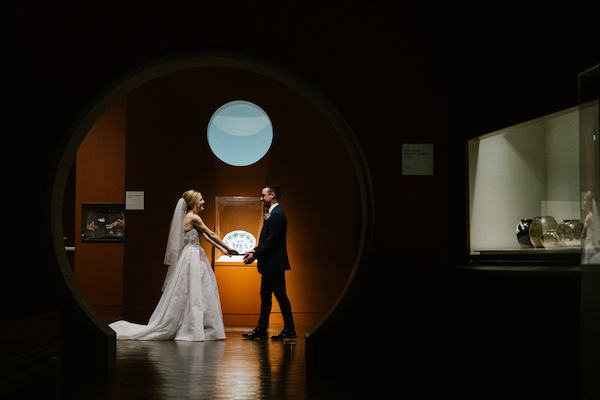 bride and groom inside of the Newfields museum of art