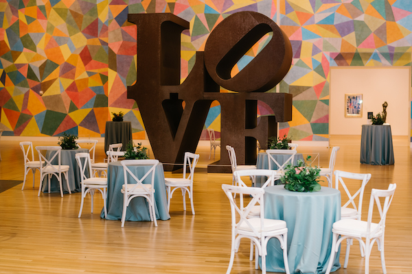 tables surrounding the Robert Indiana LOVE statue at Newfields in Indianapolis