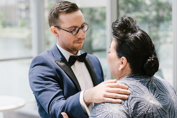 groom having a special moment with his mother before his wedding ceremony