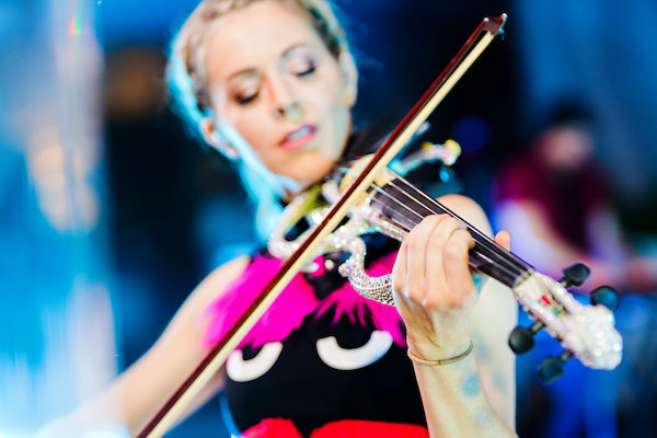 dancing violinist Lindsey Stirling playing at an Indianapolis luxury wedding
