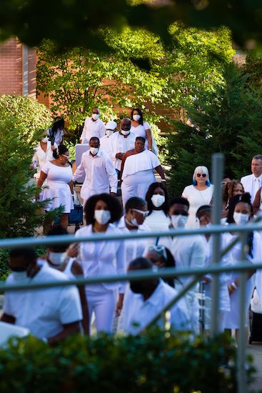 Guests heading to an undisclosed location for the 2021 Indianapolis Diner en Blanc