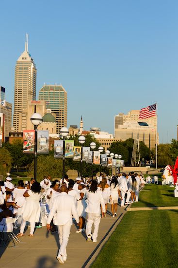 Guests arriving on the White Street Bridge for the 2021 Indianapolis Diner en Blanc