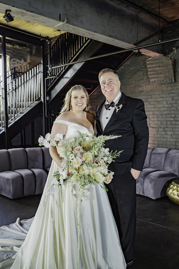 bride standing with her smiling father at her fantastic Ft Wayne wedding 
