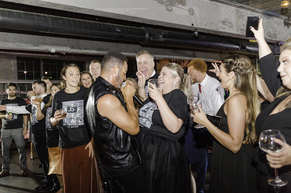 excited bride as singers from O-Town serenade her at her ft Wayne wedding