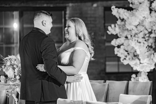 black and white photo of a bride and groom during their first look