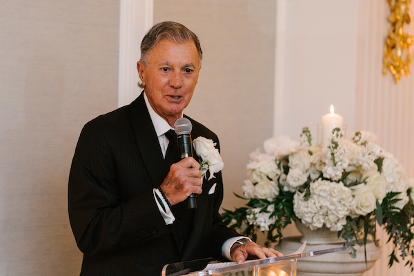 Father of the bride making a toast during his daughter's wedding reception