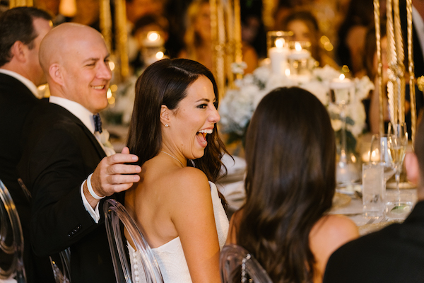bride and groom laughing during toasts at their Hotel Carmichael wedding