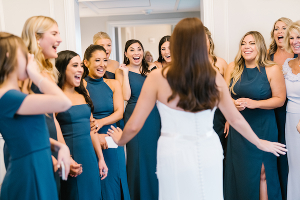 wedding party seeing the bride for the first time 