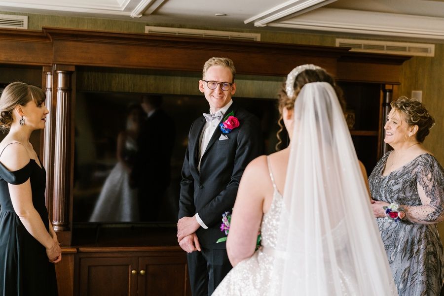 bride having a first look with her brother who will walk her down the aisle