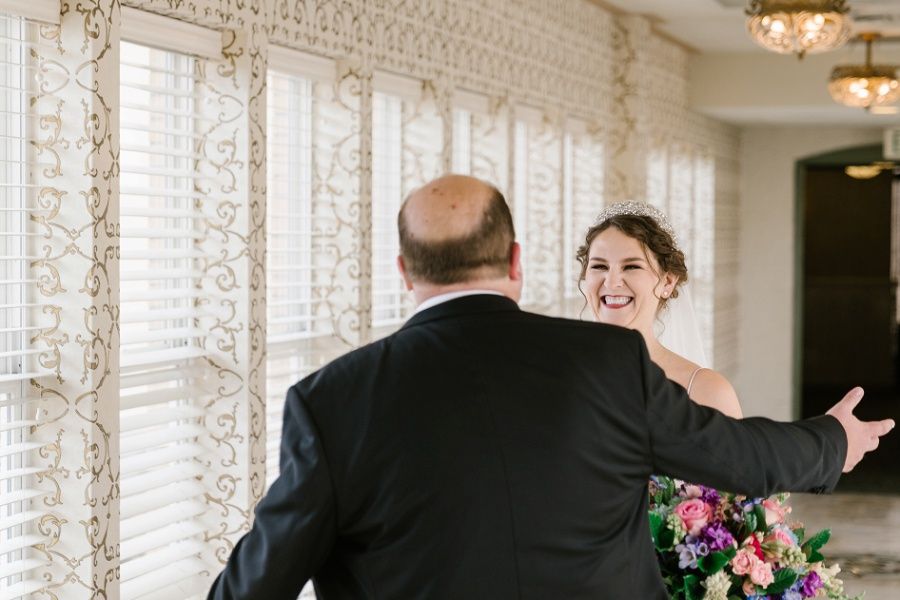 bride and groom's first look at the West Baden Springs Hotel