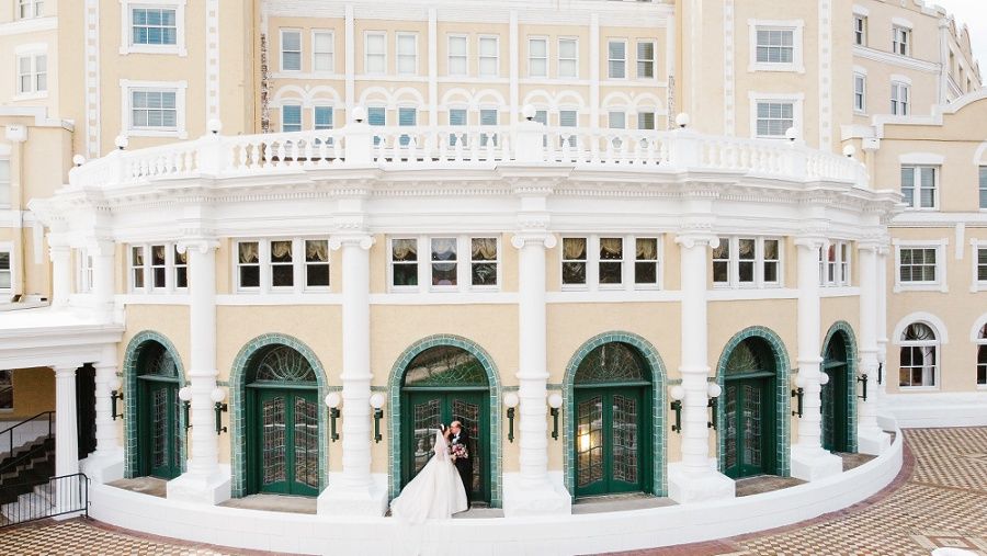 bride and groom outside of the West Baden Spring Hotel at the French Lick Resort