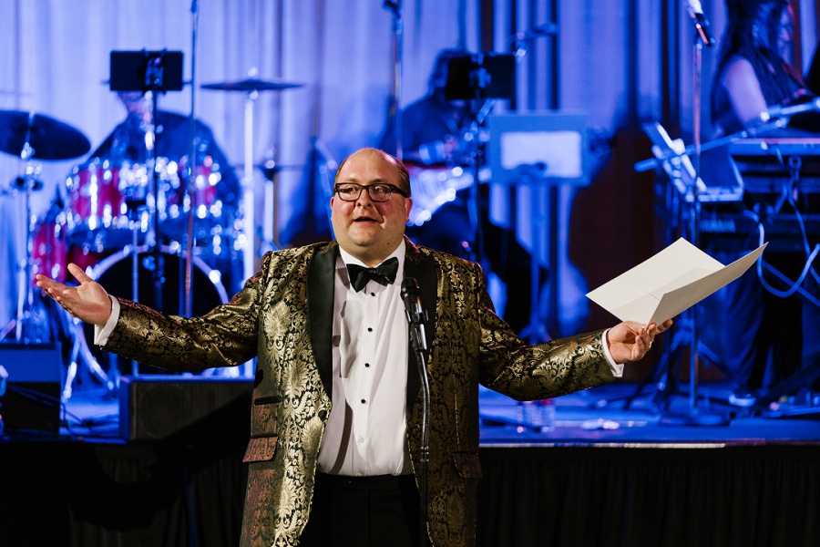 groom welcoming guests to his West Baden wedding reception