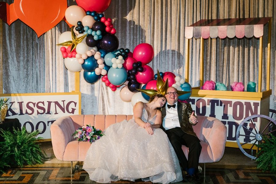 Happy couple resting after thier West baden Spring carousel themed wedding reception