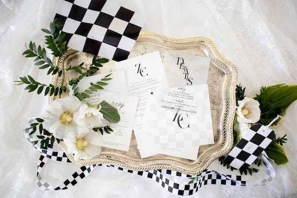 modern black and white wedding invitations with checkered flag motif