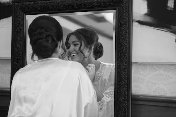 Indianapolis bride looking in the mirror