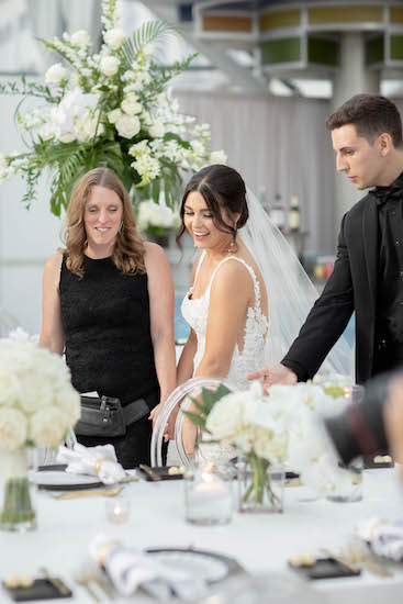 Bride and groom's sneak peek at the reception deor with Master Wedding Planner Monica Richard of <mon Amie Events in Indianapolis