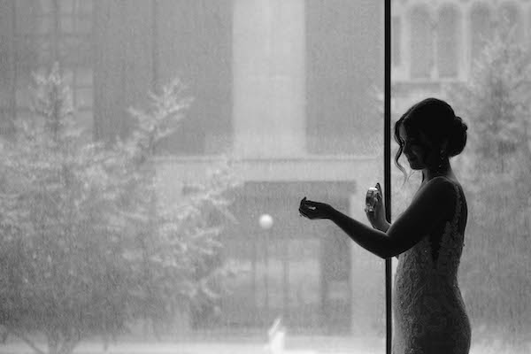 Bride in front of a window in downtown Indianapolis