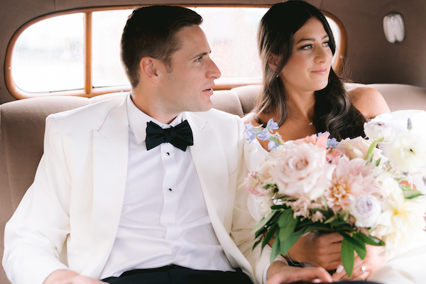 Indianapolis bride and groom riding in a vintage car