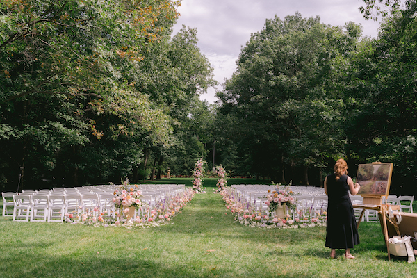 artist capturing luxurious outdoor wedding ceremony at Newfields