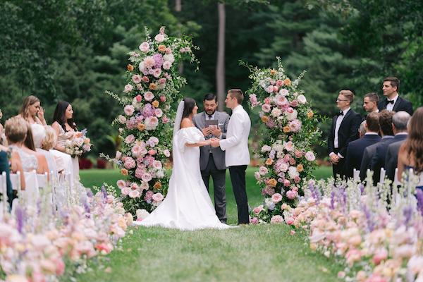 bride and groom exchanging vows at Newfields