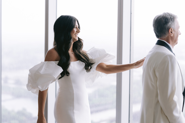 bride having her first look with her father