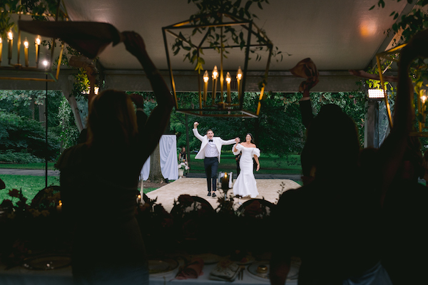 bride and groom making their grand entrance at their wedding reception