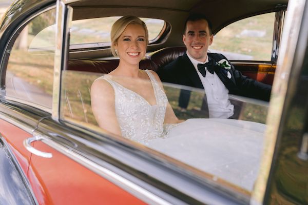 Indianapolis bride and groom riding in a vintage Rolls Royce