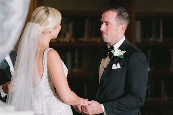 Bride and groom exchanging vows during their wedding ceremony