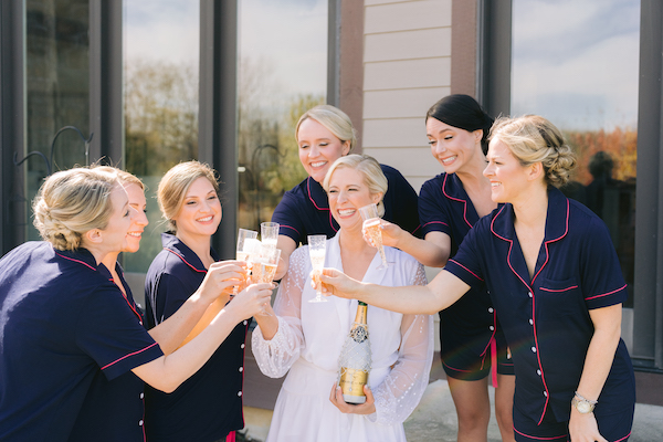 Indianapolis bride and wedding party making a Cheers