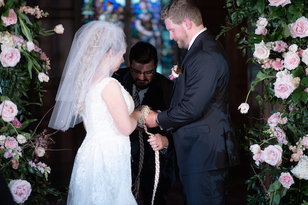 Hand-fasting during a wedding ceremony at the Scottish Rite Cathedral in Indianapolis