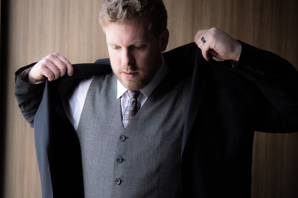 Indianapolis groom putting on his jacket