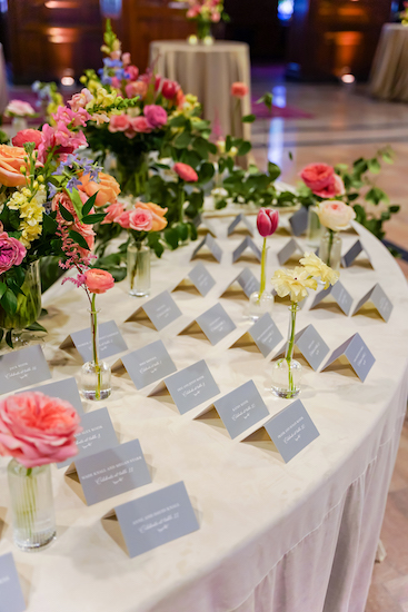 Escort card table for a colorful wedding