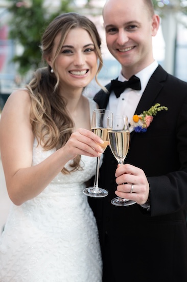 Indianapolis couple enjoying a glass of champagne and a sneak peek at their wedding reception