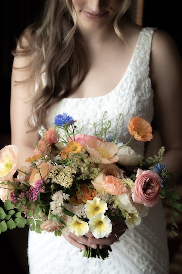 Indianapolis bride holding a bouquet of summer flowers