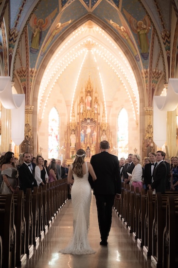 Bride and her father walking down the aisle at Sacred Heart of Jesus Catholic Church in Indianapolis
