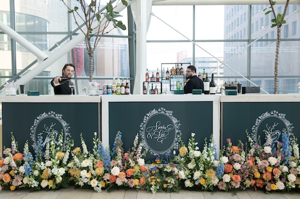 Beautiful custom bar front overflowing with flowers