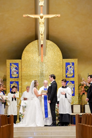 Wedding ceremony inside Our Lady of Mt. Carmel in Carmel Indiana