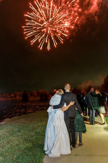 Carmel Indiana bride and groom watching fireworks at their Coxhall Garends wedding reception