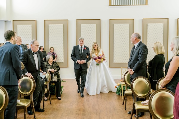 Bride walking down the aisle with her father at Coxhall Mansion