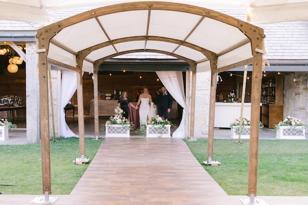 Bride and groom with Master Wedding Planner Monica Richard of Mon Amie Events, Inc. taking a sneak peek at their Wisconsin destination wedding decor.