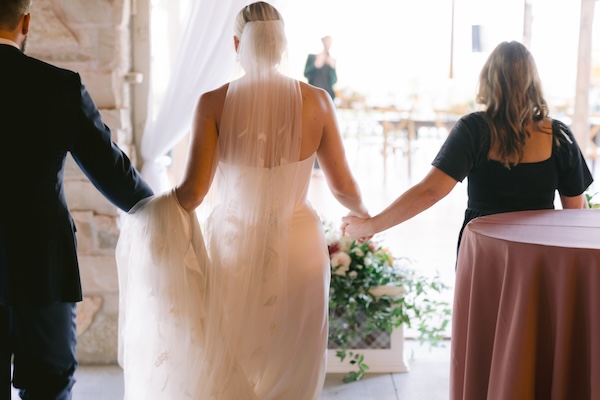 Bride and groom with Master Wedding Planner Monica Richard of Mon Amie Events, Inc. taking a sneak peek at their Wisconsin destination wedding decor.