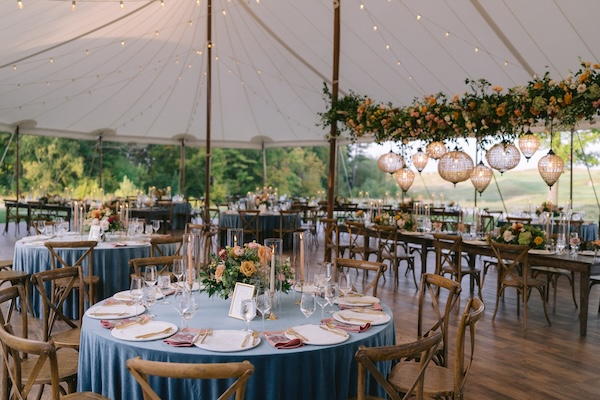 Beautiful wedding reception decor under a pole tent at Whispering Straits.