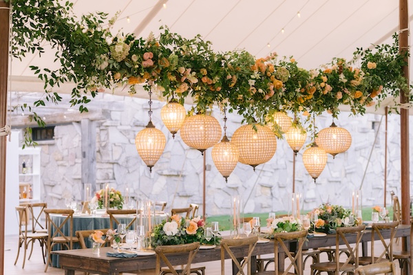 Beautiful wedding reception decor under a pole tent at Whispering Straits.