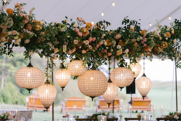 Beautiful wedding reception decor under a pole tent at Whispering Straits.