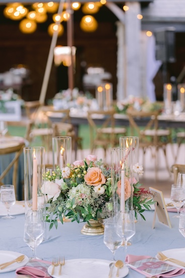 Beautiful wedding reception decor under a pole tent at Whispering Straits.