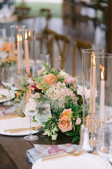 Beautiful wedding reception decor under a pole tent at Whispering Straits.