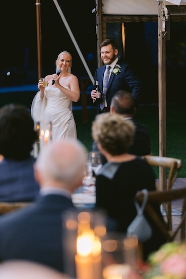 Bride adn groom welcomeing thier guests at their Whistling Straits wedding reception.